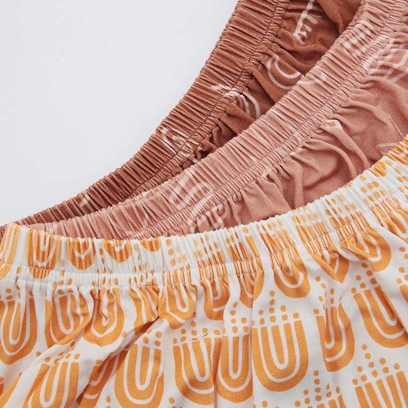 Wholesale baby bamboo pajamas in Carhartt-inspired designs, ideal for retailers seeking sustainable, soft, and stylish infant clothing options.